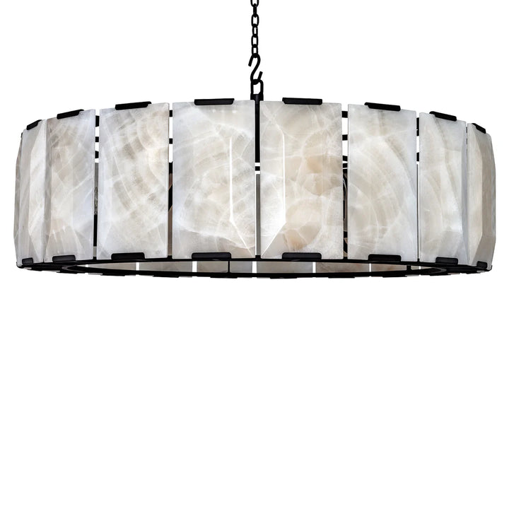 Round onyx chandelier featuring handcrafted natural stone panels, black iron frame, and warm ambient illumination in a modern luxury drum design.